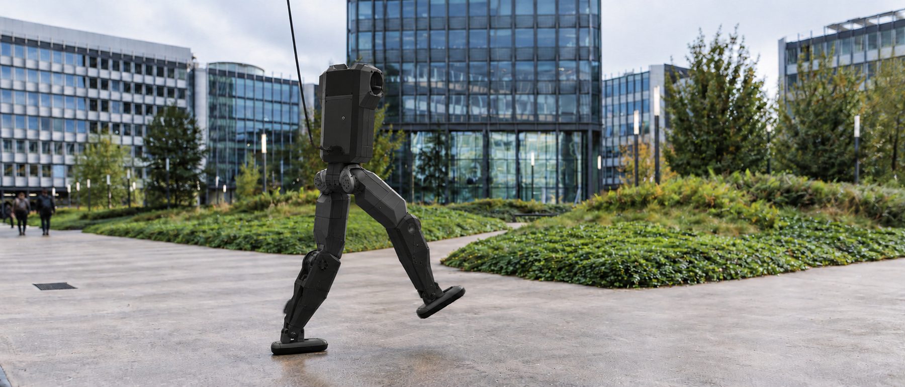 Vue d'artiste du robot marchant sur un campus, retenu par une longe